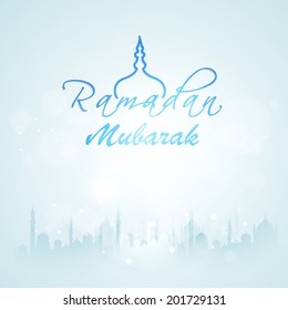 Silhouette of mosque on shiny blue background for holy month of Muslim community celebrations Ramadan Mubarak. 