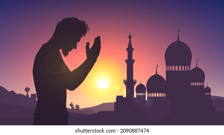 Silhouette of a mosque and a praying man on the background of sunset or dawn