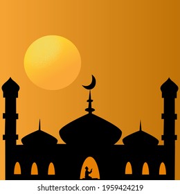 Silhouette mosque when sun goes down. A man praying at the mosque. Ramadan time