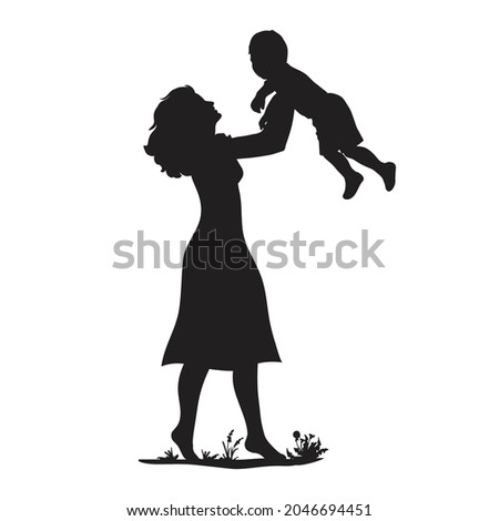 Silhouette of a mother with a baby in her arms
