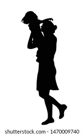 Silhouette of a mother holding a kid