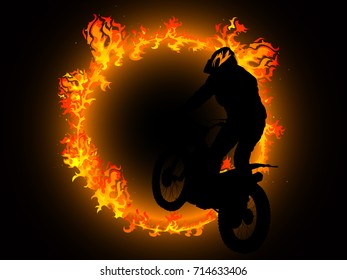 Silhouette of motorcyclist and fire circle
