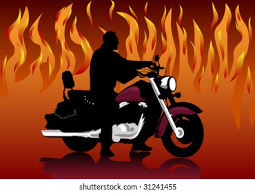 Silhouette of the motorcyclist on a background of fire