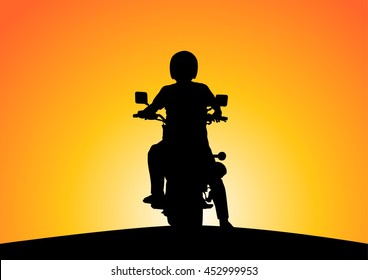 Silhouette of motorcyclists on nature at sunset.
