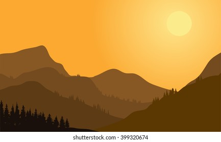 Silhouette of mountain and forest at sunset