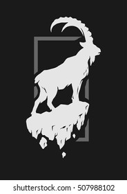 Silhouette of a mountain goat standing on a rock.