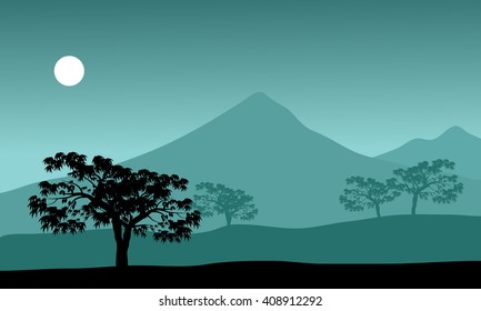 silhouette of mountain and moon at the night