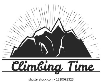 The silhouette of the mountains, the rays of the sun behind the mountains, snow caps on the tops. The inscription: climbing time