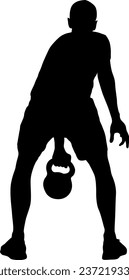 Silhouette muscular man holding kettle bell.