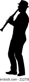 Silhouette of musician playing the clarinet on a white background.