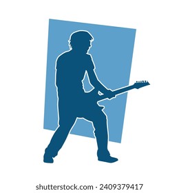 Silhouette of a musician playing electric guitar musical instrument. Silhouette of a male guitar player performing.