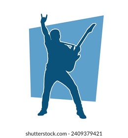 Silhouette of a musician playing electric guitar musical instrument. Silhouette of a male guitar player performing.