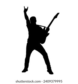 Silhouette of a musician playing electric guitar musical instrument. Silhouette of a male guitar player performing.