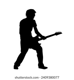 Silhouette of a musician playing electric guitar musical instrument. Silhouette of a male guitar player performing.