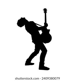 Silhouette of a musician playing electric guitar musical instrument. Silhouette of a male guitar player performing.