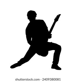 Silhouette of a musician playing electric guitar musical instrument. Silhouette of a male guitar player performing.