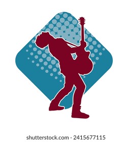 Silhouette of a musician playing electric guitar musical instrument. Silhouette of a male guitar player performing.