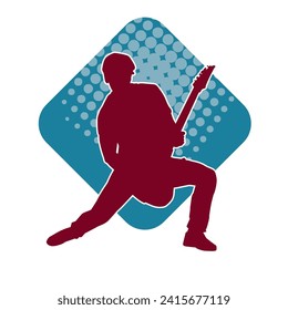 Silhouette of a musician playing electric guitar musical instrument. Silhouette of a male guitar player performing.