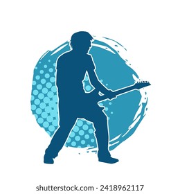 Silhouette of a musician playing electric guitar musical instrument. Silhouette of a male guitar player performing.
