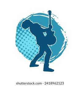 Silhouette of a musician playing electric guitar musical instrument. Silhouette of a male guitar player performing.
