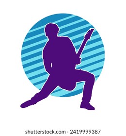 Silhouette of a musician playing electric guitar musical instrument. Silhouette of a male guitar player performing.