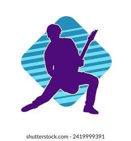 Silhouette of a musician playing electric guitar musical instrument. Silhouette of a male guitar player performing.