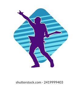 Silhouette of a musician playing electric guitar musical instrument. Silhouette of a male guitar player performing.