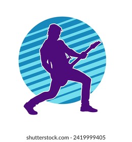 Silhouette of a musician playing electric guitar musical instrument. Silhouette of a male guitar player performing.