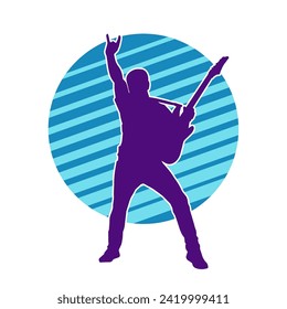 Silhouette of a musician playing electric guitar musical instrument. Silhouette of a male guitar player performing.