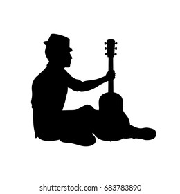 Silhouette musician plays the guitar. Vector illustration.