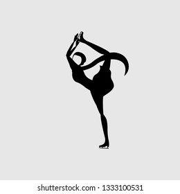 Silhouette of muslim girl in hijab figure skating on ice rink. Ice skating.