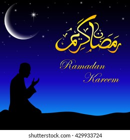 Silhouette of a Muslim praying in the when night