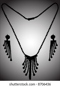 Silhouette of necklace and ear-drop