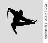 silhouette of a ninja carrying a sword 