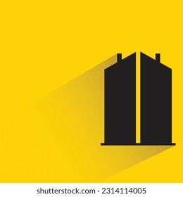 silhouette office building icon with shadow on yellow background