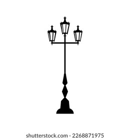 Silhouette of an old street light. Subject of street architecture, decorative street lighting. Black silhouette, vector illustration isolated on white background. Old vintage classic streetlight.