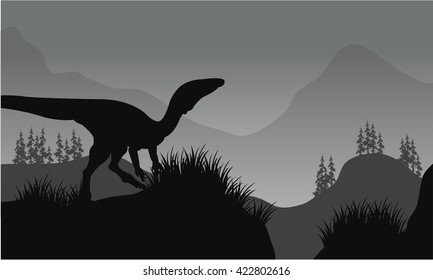 Silhouette of one eoraptor in hills with gray backgrounds