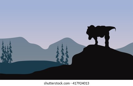 Silhouette of one tyrannosaurus in the hills
