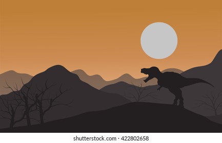 Silhouette of one tyrannosaurus in hills with sun at afternoon