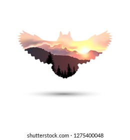 Silhouette of owl with coniferous trees on the background of mountains and colorful sky. Sunset.