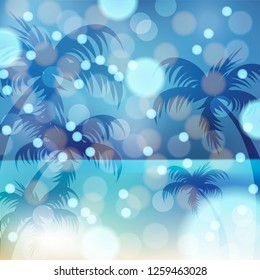 
Silhouette of a palm tree on a blue background with bokeh effect