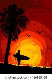 Silhouette of a palm tree and a surfer at sunset