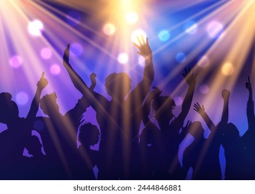 Silhouette of a party audience dancing under spotlights 