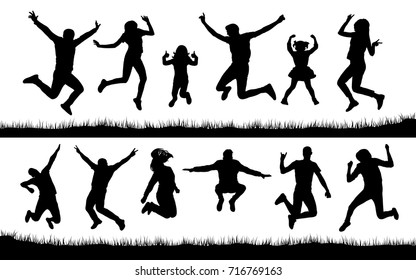 Silhouette of people jumping on the grass