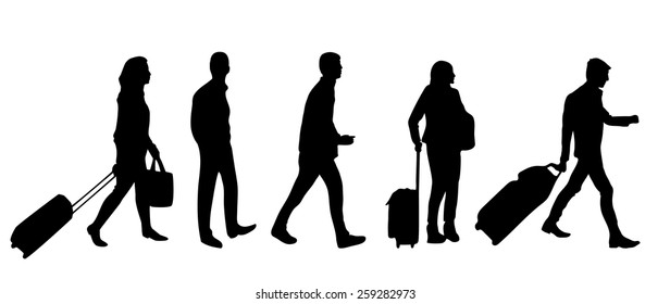 Silhouette of people with luggage walking in airport 