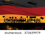 Silhouette of people protesting with flag of Germany as a background