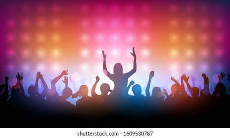 Silhouette of people raise hand up dancing in concert with spotlight on stage background