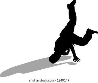 silhouette of person breakdancing