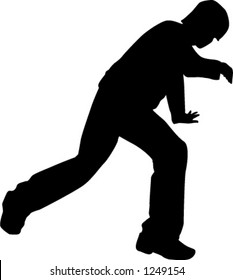silhouette of person breakdancing