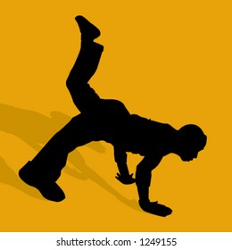 silhouette of person breakdancing